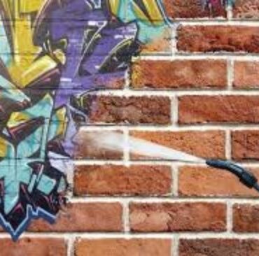 Graffiti removal from brick wall